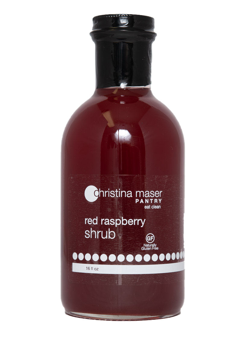 Good Food Award Winning Red Raspberry Shrub in clear glass bottle with black lid. Shrub is deep raspberry red.