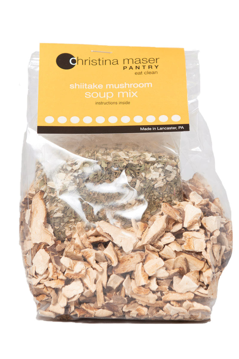 Shiitake mushroom dry soup mix. Close up of dried mushrooms and spices in clear cello bag with orange label.