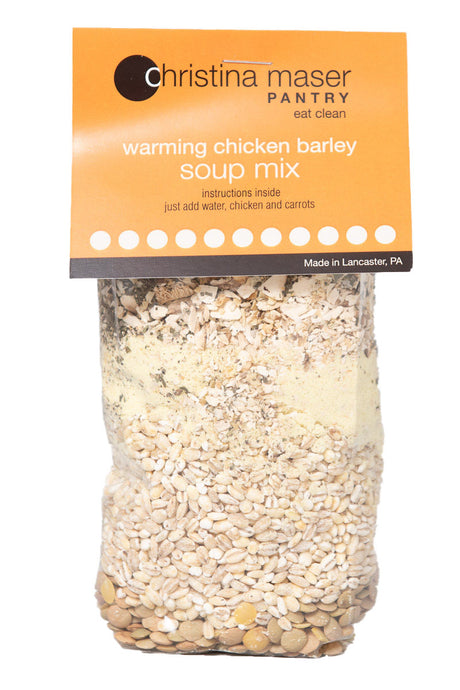 Photo of Chicken Barley dry Soup Mix. Close-up of grains and spices in a clear cello bag with an orange label.