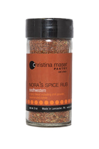 Southwestern Spice rub in clear glass jar with black lid and rich brown label with orange accents.