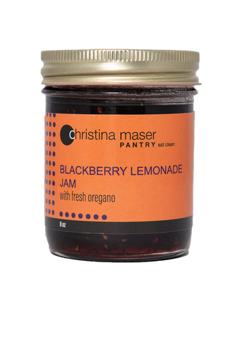 Blackberry Lemonade Jam in a glass mason jar with orange wraparound label. Jam is all-natural, gluten-free, and made with local ingredients only.
