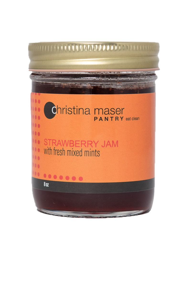 Strawberry mint jam in clear glass mason jar with orange label.