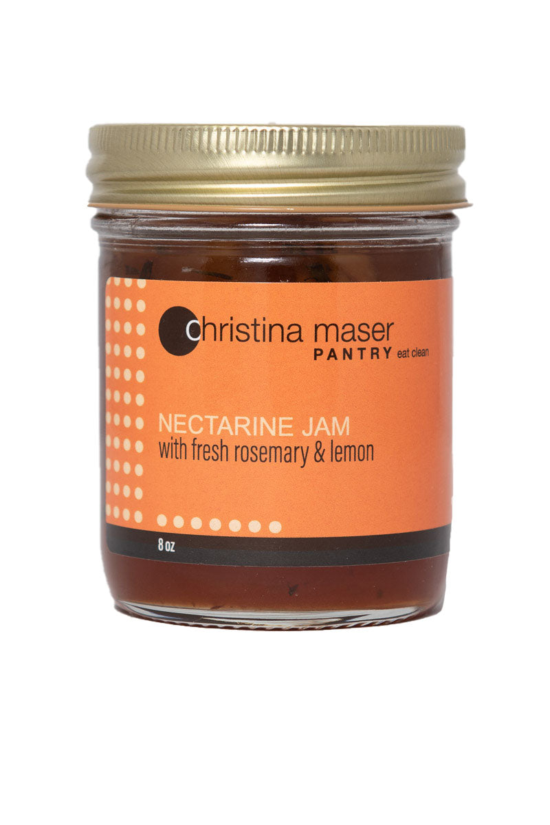 Nectarine with Rosemary jam in clear glass mason jar with orange wraparound label. Jam is handmade with local ingredients in small batches in Lancaster, PA.
