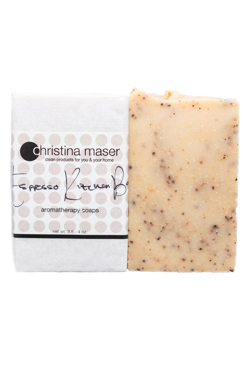 Espresso Kitchen Bar vegan bar soap. All natural hand poured soap. Soap is natural colored with pops of ground espresso. Bar is wrapped in white paper with wraparound label with beige/brown dot accents.