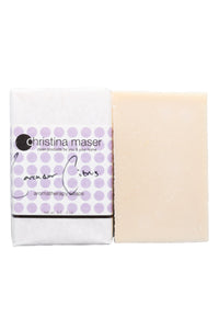 Lavender citrus vegan bar soap. Soap is natural colored and wrapped in white paper. Label has light purple dot accents and black text.