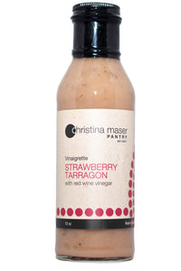 Strawberry Tarragon vinaigrette in clear bottle with black lid. Label is off white with pinkish red accents.