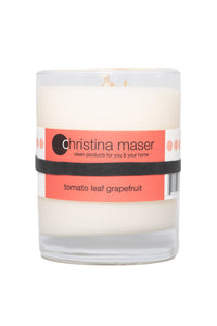 Tomato Leaf Grapefruit soy wax candle in clear glass tumbler with red label.